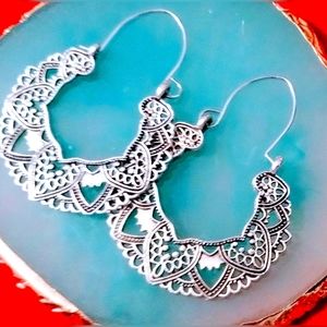 Pair of Sliver plated dangle earrings. New never worn